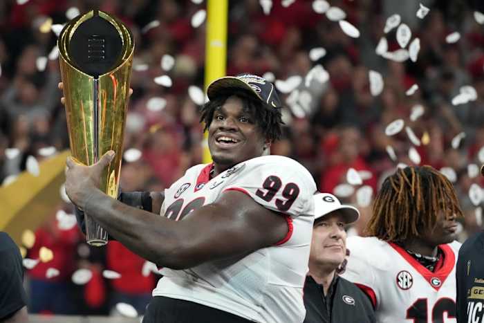 Georgia defensive lineman Jordan Davis celebrates with National Championship trophy